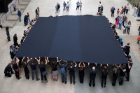Performers unveiling Liberate Tate's Black Square